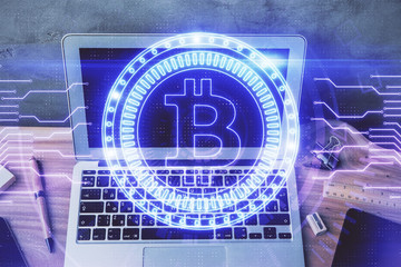 Double exposure of blockchain theme hologram and table with computer background. Concept of bitcoin...