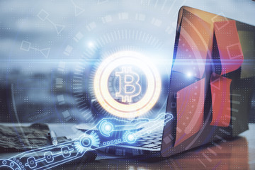 Double exposure of blockchain theme hologram and table with computer background. Concept of bitcoin...