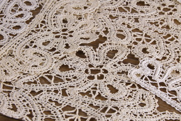 Vologda lace on a wooden background piece production handmade folk art vintage