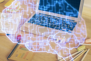 Multi exposure of work table with computer and brain hologram. Brainstorm concept.