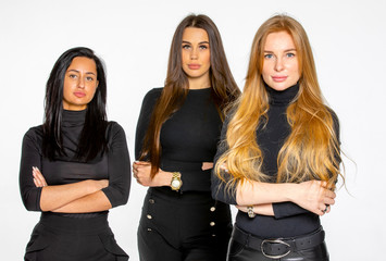 three young female friends pose together in the Studio. women employees of a beauty salon