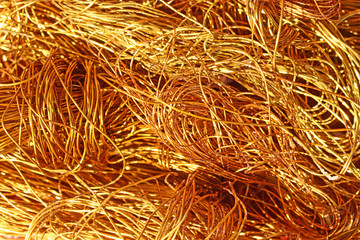 The texture of a heap of copper wire. Conductive metal electrical cable. Scrap metal and secondary raw materials.