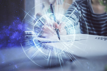 International business hud over woman's hands writing background. Concept of hard work. Double...
