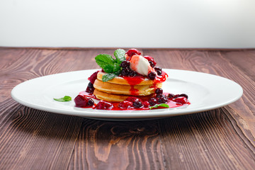 American pancakes with strawberry and black currant jam