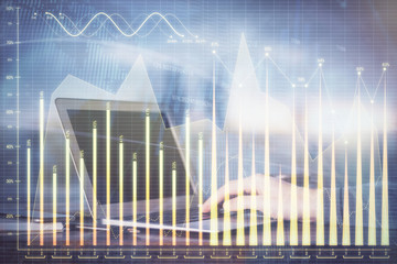 Double exposure of stock market graph with man working on laptop on background. Concept of financial analysis.