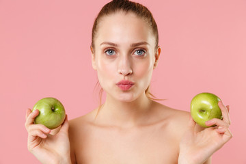 Close up blonde half naked woman 20s perfect skin nude make up hold apple isolated on pastel pink wall background studio portrait. Skin care healthcare cosmetic procedures concept. Mock up copy space.