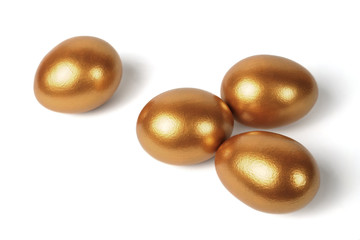 Golden eggs on a white background