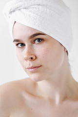 Young Woman with white Towels. Spa, skincare, beauty, cosmetics, wellness concept