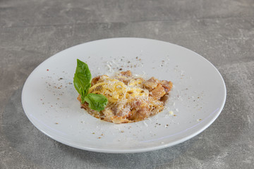Italian pasta dish - Spaghetti alla carbonara on stone table