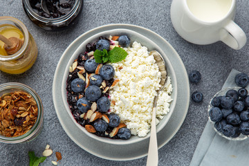 healthy breakfast. Cottage cheese with fresh berry, nuts and honey