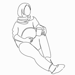Muslim pregnant woman drinks coffee