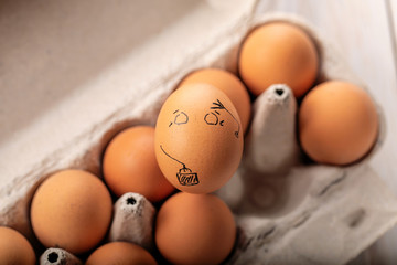 One egg stands out from crowd of other eggs. Concept of rejection, hostility, exclusion, exile