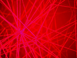 abstract red background texture stretched thread.