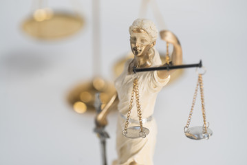 Statue of Themis on a white background, justice