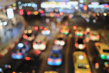 Blured of Heavy traffic Jam at the night time in bangkok. with circular bokeh. space for text. with selective focus