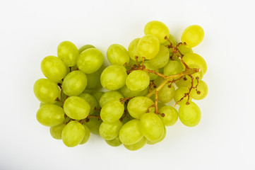 Large green juicy grape on a white background. Flat lay. view from above. Place for writing. A bunch of green grapes