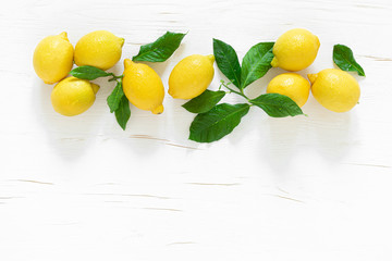 Fresh lemons with leaves, vitamin c concept, top view