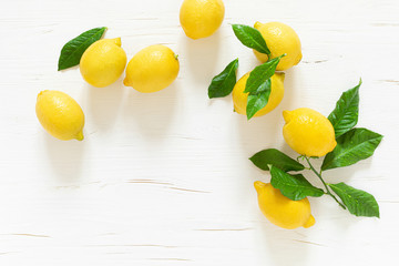 Fresh lemons with leaves, vitamin c concept, top view