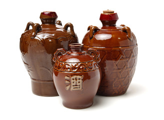 rice wine jar with ceramic bowl on white background