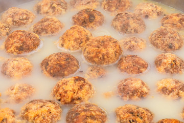 Cooked deep-fried meatballs made from cooked pork and cooked rice.Chinese food.