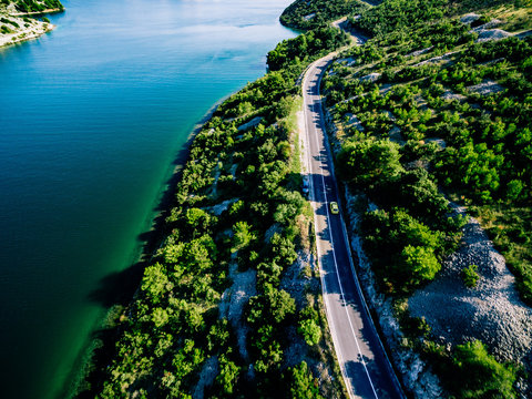 Aerial View Of Road Near Blue Sea And Green Mountain In Summer Croatia.