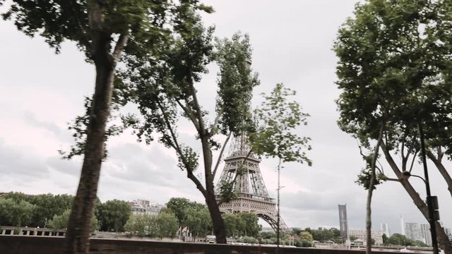 Paris, France - 15.08.2019, the car drives past the Eiffel Tower