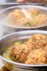 Cooked deep-fried meatballs made from cooked pork and cooked rice.Chinese food.