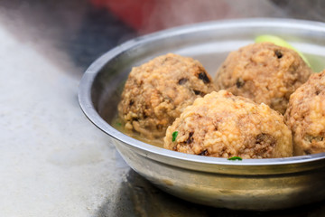 Cooked deep-fried meatballs made from cooked pork and cooked rice.Chinese food.