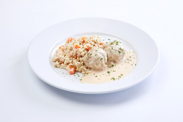 meatballs with barley on the white plate