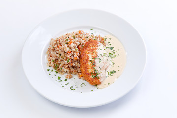 cutlet with buckwheat on the white background
