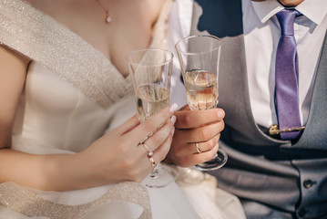 Glasses of champagne in the hands of a couple on a date
