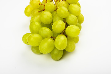 Large green juicy grape on a white background. Flat lay. view from above. Place for writing. A bunch of green grapes