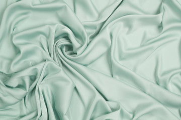 Fabric satin silk drapery. Blue textile