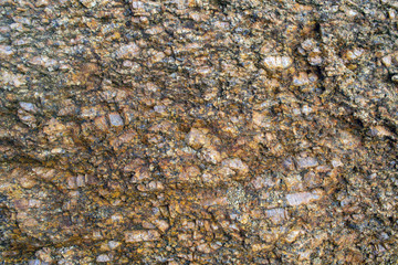  Texture of stony granite rock red.