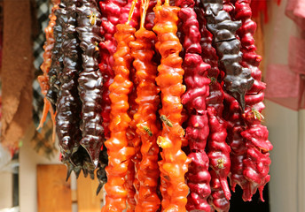 Vibrant Color Delectable Churchkhela, Georgian Traditional Sweets for Sale Attracting Many Bees