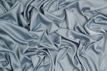 Fabric satin silk drapery. Blue textile