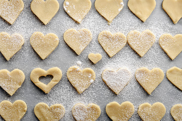 Fototapeta na wymiar top view of cookies hearts sprinkled with powdered sugar for Valentine's day