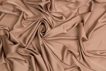 Fabric satin silk drapery. Gold textile