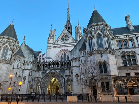 London's Royal Courts of Justice at dusk, England