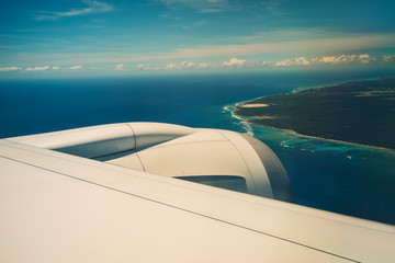 Wing of an airplane flying above the Punta Cana, Dominican republic