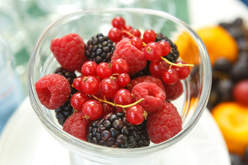 Mix of berries in a glass container