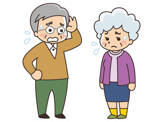 困った表情を浮かべるシニア男女