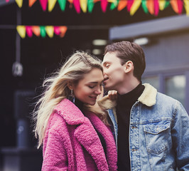 Naklejka premium Portrait of a happy romantic couple outdoors in european city