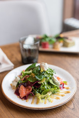 Salmon and Roasted Beets Salad with Herbed Cream Cheese and Mustard Dressing. Lunch Served in Cafe