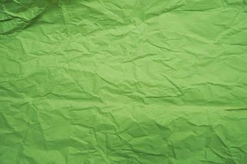 Green crumpled paper empty background
