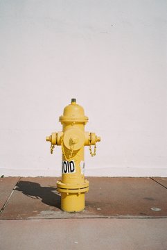 yellow hydrant fire fountain