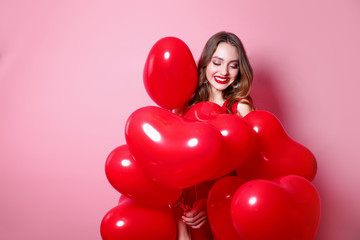 Valentine beauty girl with red heart air balloon portrait on pink background. Birthday party, .