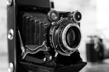 Fototapeta na wymiar Film camera with a vintage lens