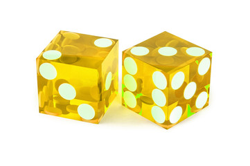 Two yellow professional game dice closeup isolated on a white background / two and three with a light shadow.