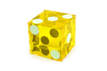 Macro yellow dice isolated on white / result as three on top with a light shadow
